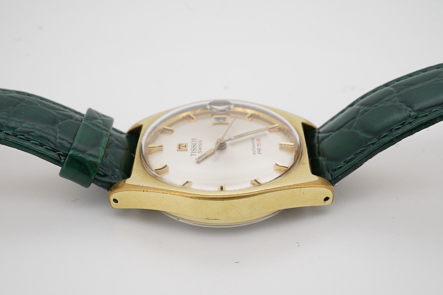 A gentleman's steel and gold plated Tissot Automatic PR 516 wrist watch, with baton numerals and date aperture, case diameter 34mm, on an associated Hirsch leather strap, no box or papers. Condition - Fair to good